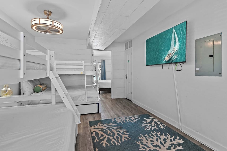 Bunk room with flat screen TV