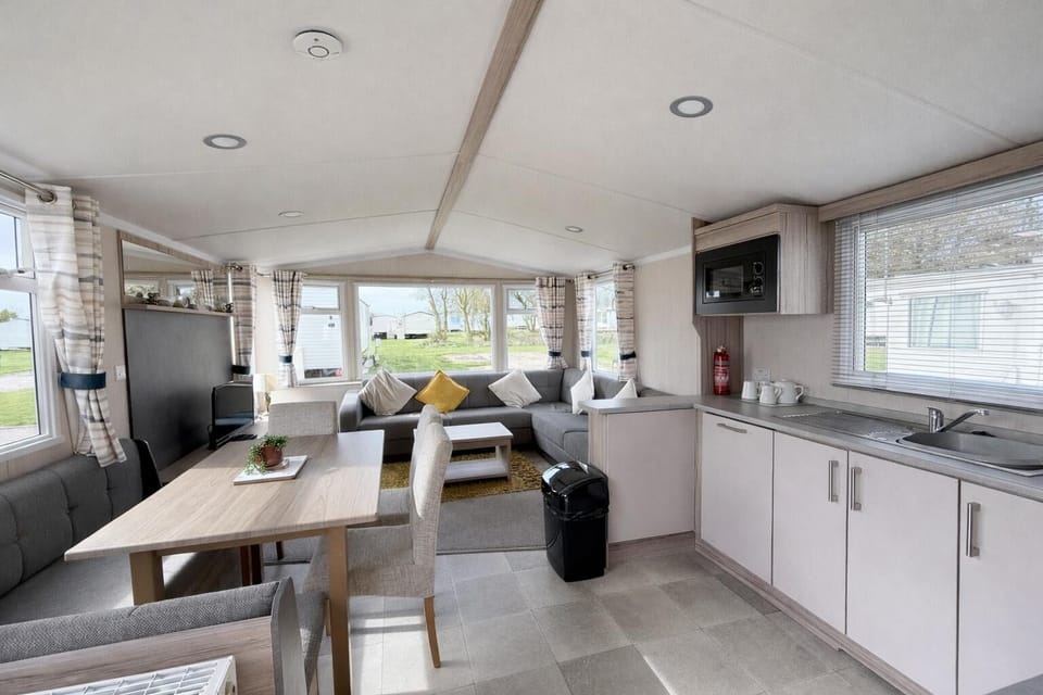 The dining table in our caravan offers more than just a place to eat; it is a venue for reliving your traditional seaside fun