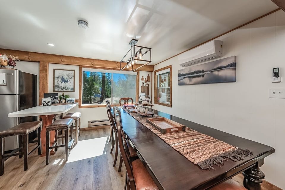 The kitchen is open to the dining area. It is a great space to visit while preparing meals