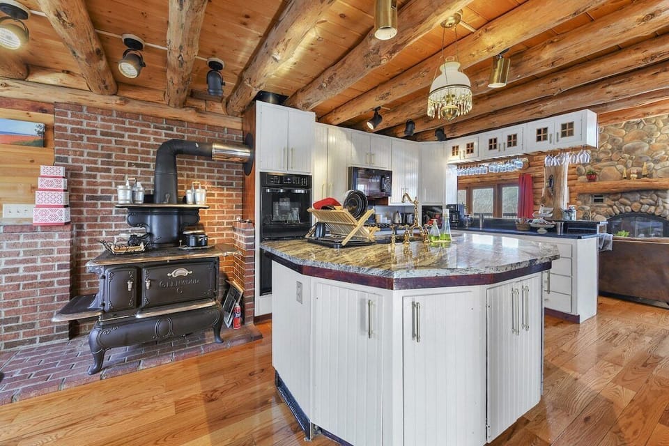 Antique wood burning stove in kitchen.
