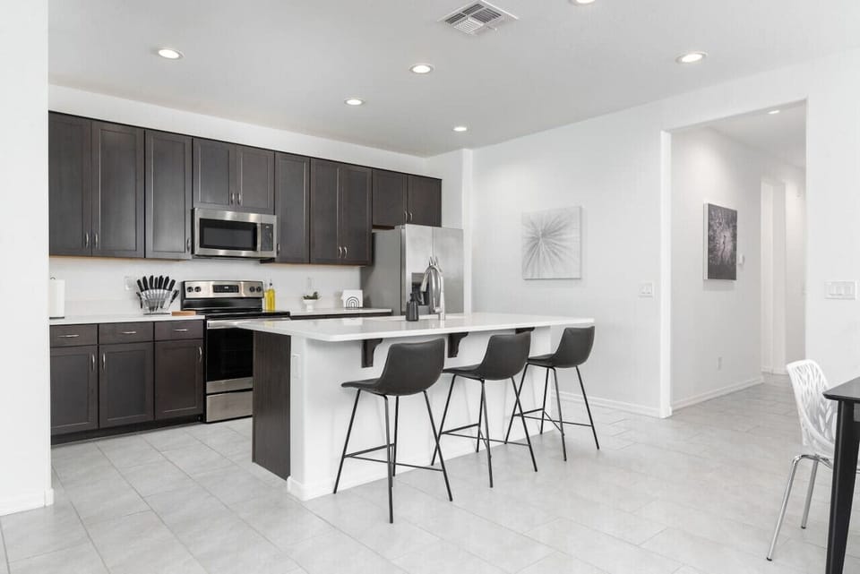 Have a few drinks at the kitchen island while watching the designated chef in action.
