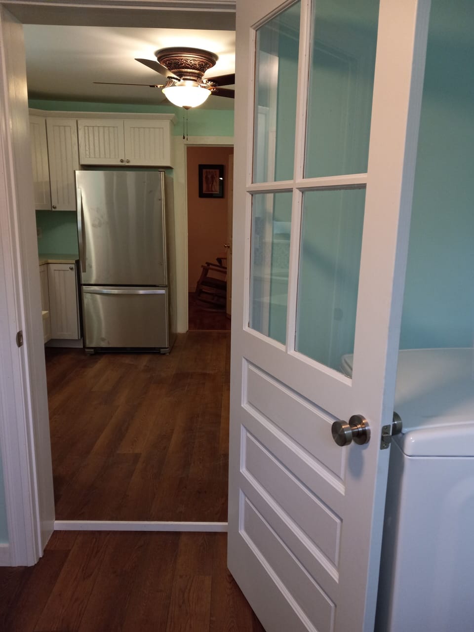 entry through outer room into kitchen
