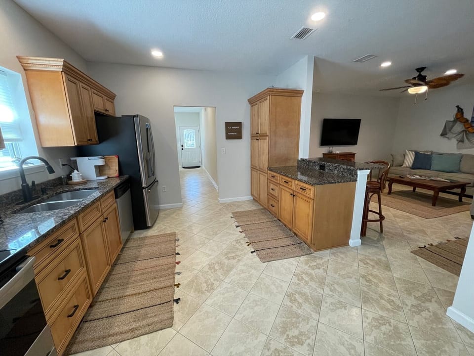 open concept living/kitchen/dining/bar area