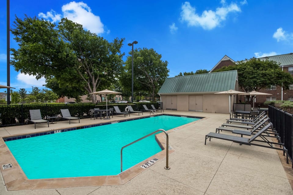 Dive into sunny afternoons by the sparkling outdoor pool.