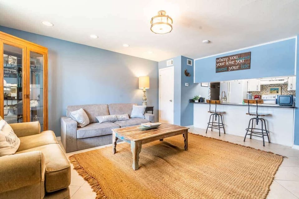 Living room with a pull-out couch and a smart TV for your entertainment.