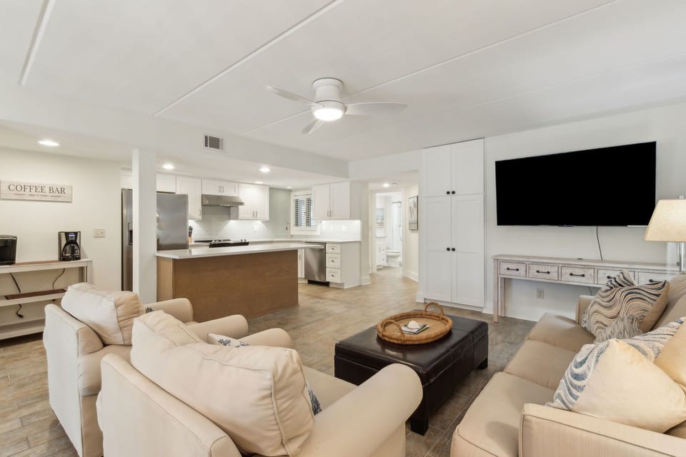 Sunny Living and Dining Area with Sliding Glass Doors to Covered Patio