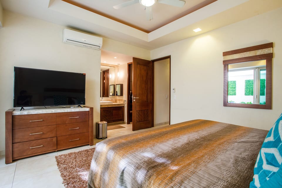 Air-conditioning bedroom has an ensuite bathroom and a smart TV