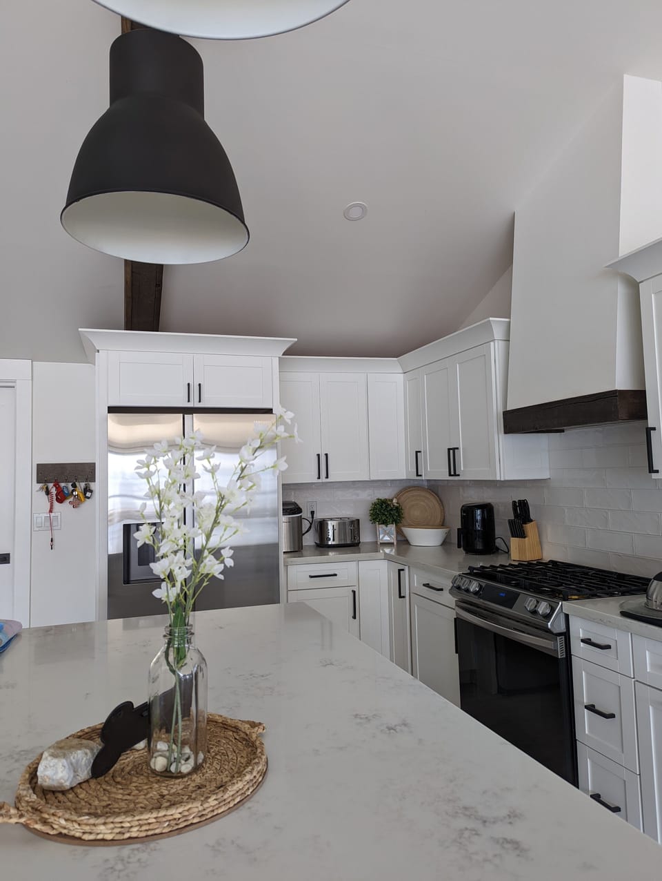 Stainless appliances including wine fridge.