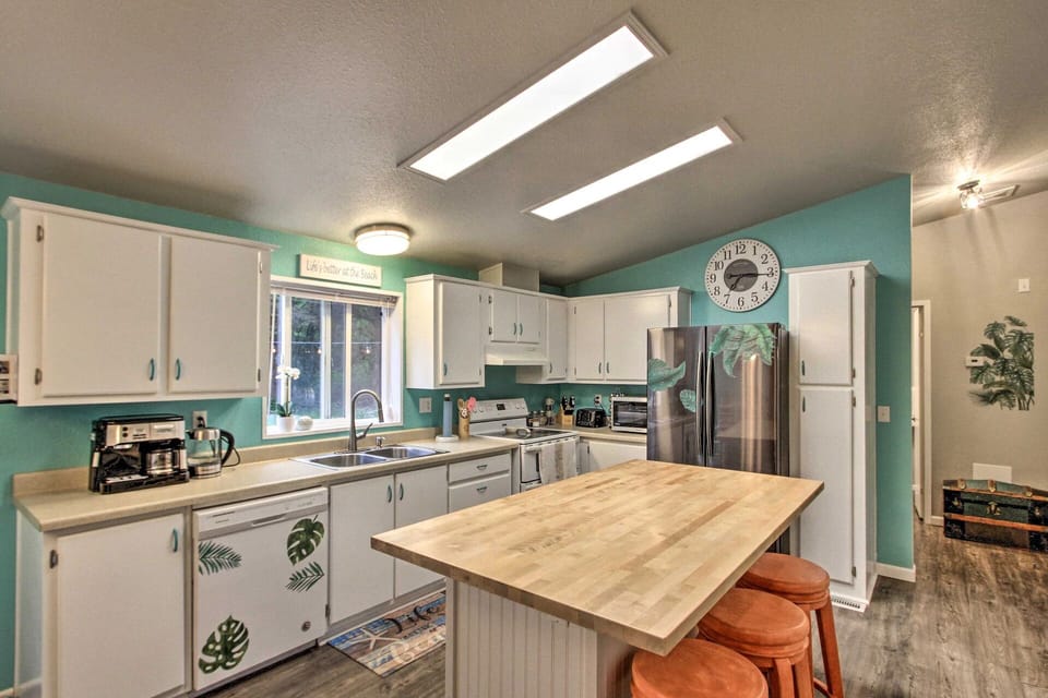 Lovely kitchen featuring sky lights and 3 bar stool, perfect for enjoying meals