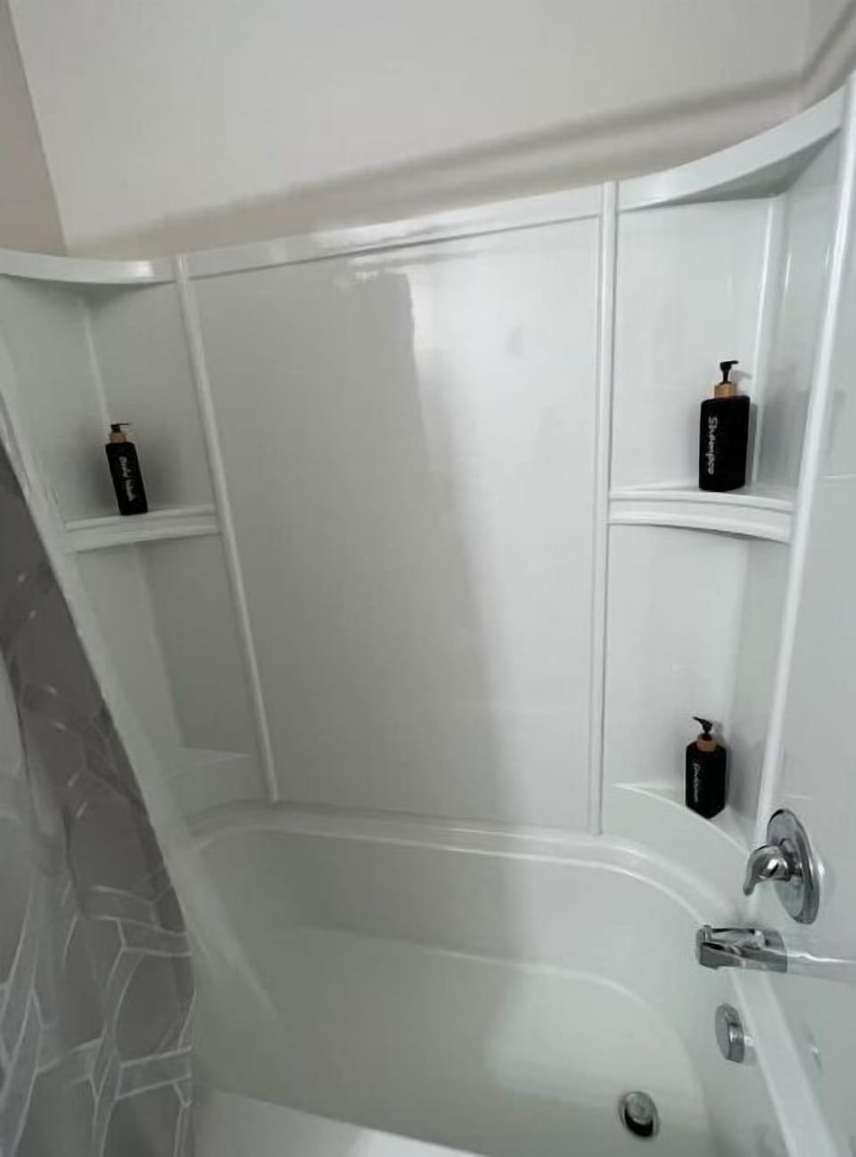 Large bath tub with shampoo, conditioner, body wash 