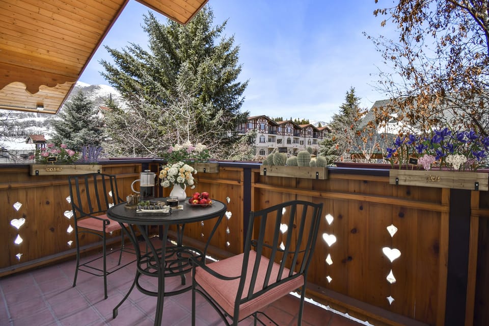 Just off the master bedroom is this charming private bistro patio with views of the Wasatch Back and the beautiful grounds of Zermatt