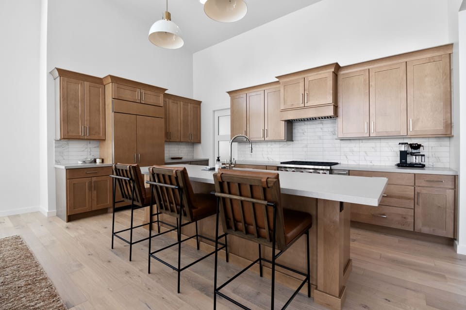A chefs kitchen with sub-zero refrigerator, Wolf Range and many other amenities are included.  Dining Room has seating for 6 plus 3 additional bar stool seats at the island