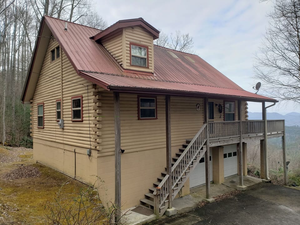 A lovingly hand crafted authentic log cabin with unobstructed mountain views.