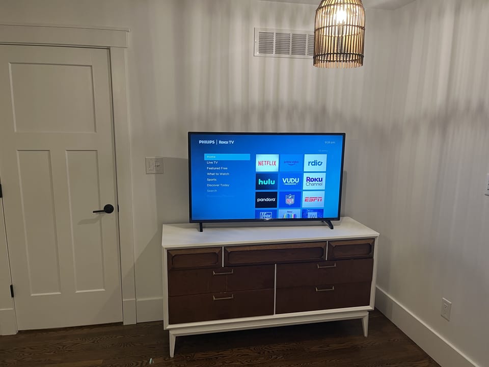 Master bedroom with 50" Smart TV
