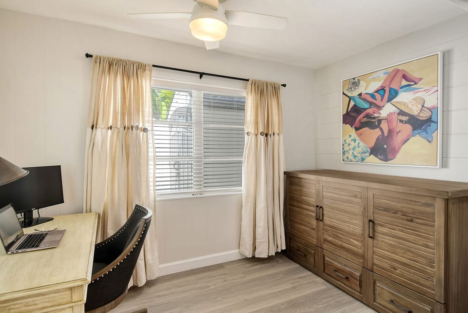Office with desk, monitor, and printer.  Murphy bed with queen size mattress