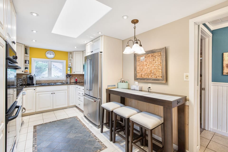 Open kitchen with bar dining area