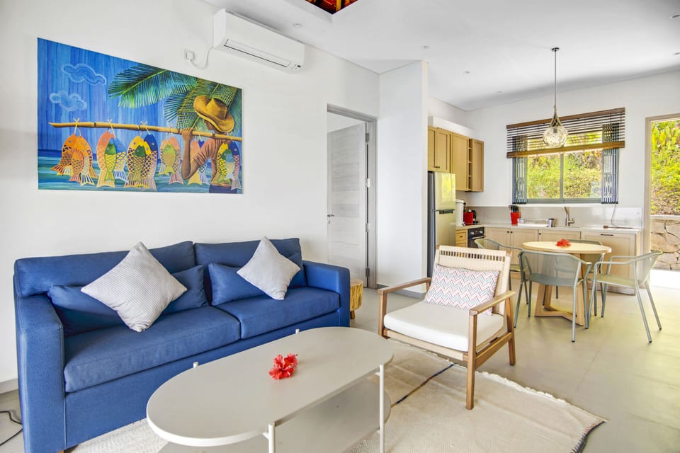 Living room and full modern kitchen with dining area