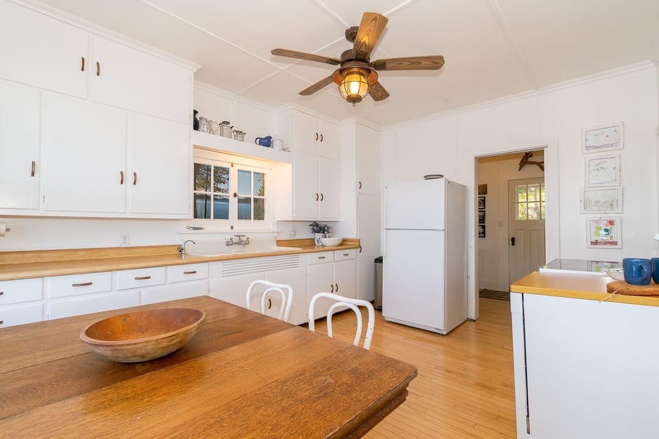 Kitchen in the Main Cottage. Stove and Dishwasher.