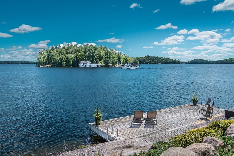 Dock from Main Cottage. Steamship passing.
