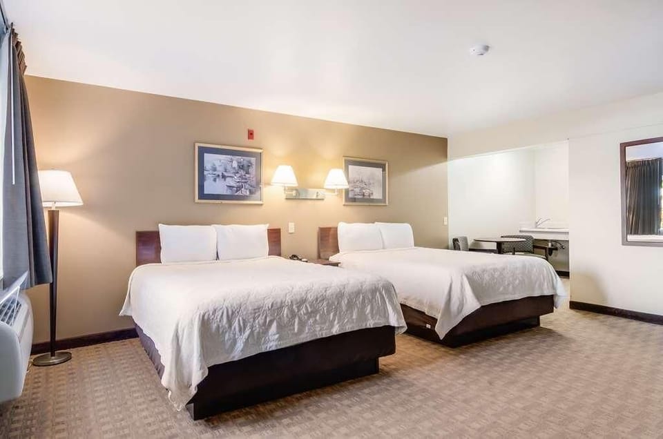 Stretch out in a spacious double-queen room made for rest.