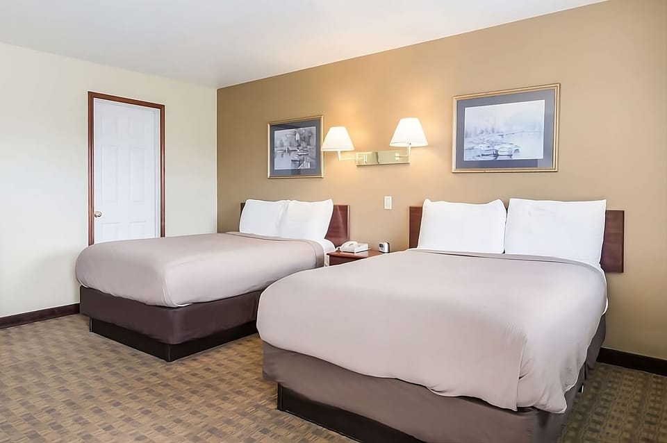 Unwind in a bright double-queen room with crisp linens.