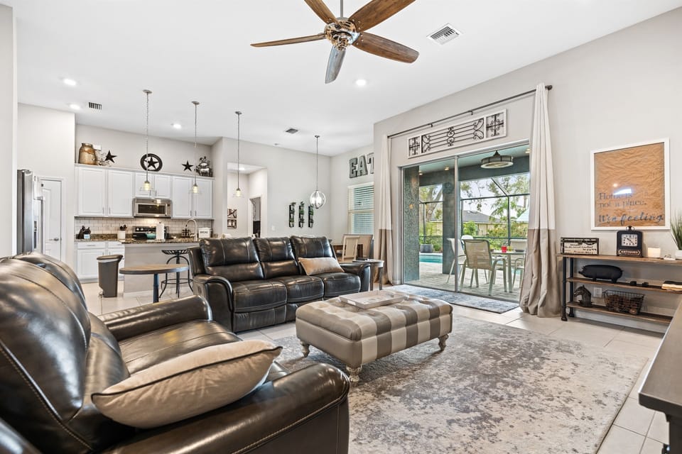 The TV Area. You have access to the pool area through the sliding glass doors.