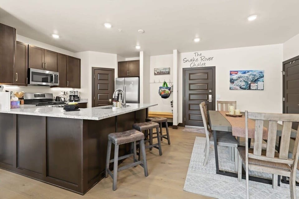 The view of the front of the condo. The front door opens into the open-layout kitchen/dining/living area, a great space for socializing with your group.