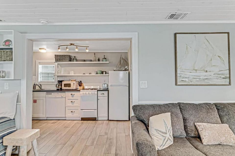 Open floor plan with kitchen, dining, and living area together.