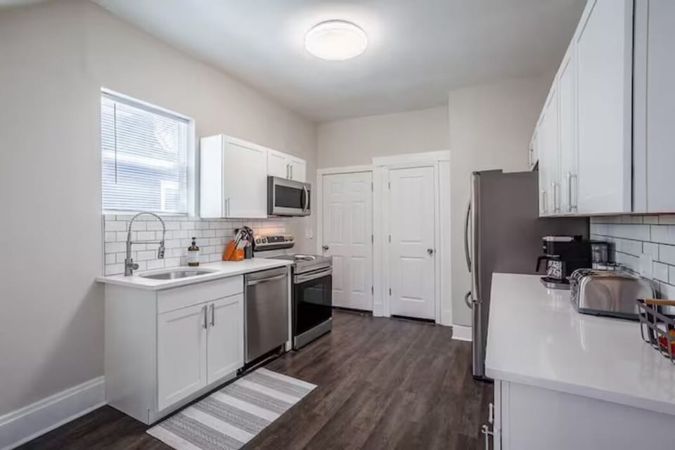 Fully renovated and stocked kitchen w/ stainless steel appliances. 