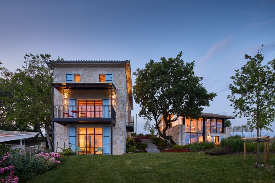 La House and L'atelier at dusk
