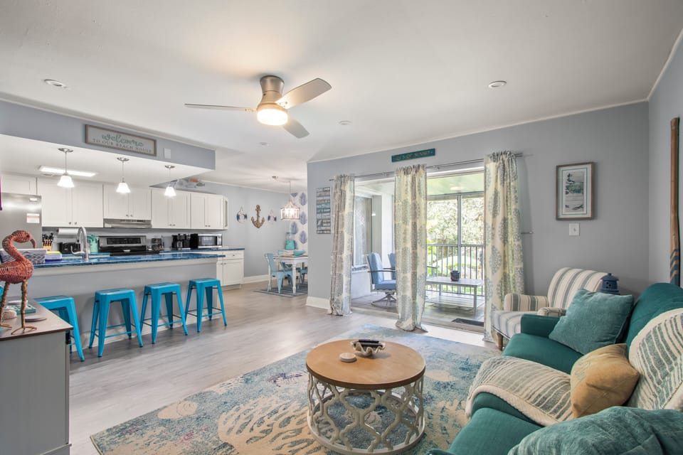 Beautifully decorated open concept living room, dining room and kitchen.