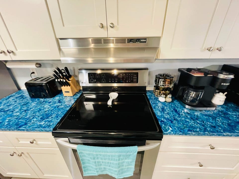 Kitchen includes Keurig Duo coffee maker, sugar, spice  rack, toaster, oil& more