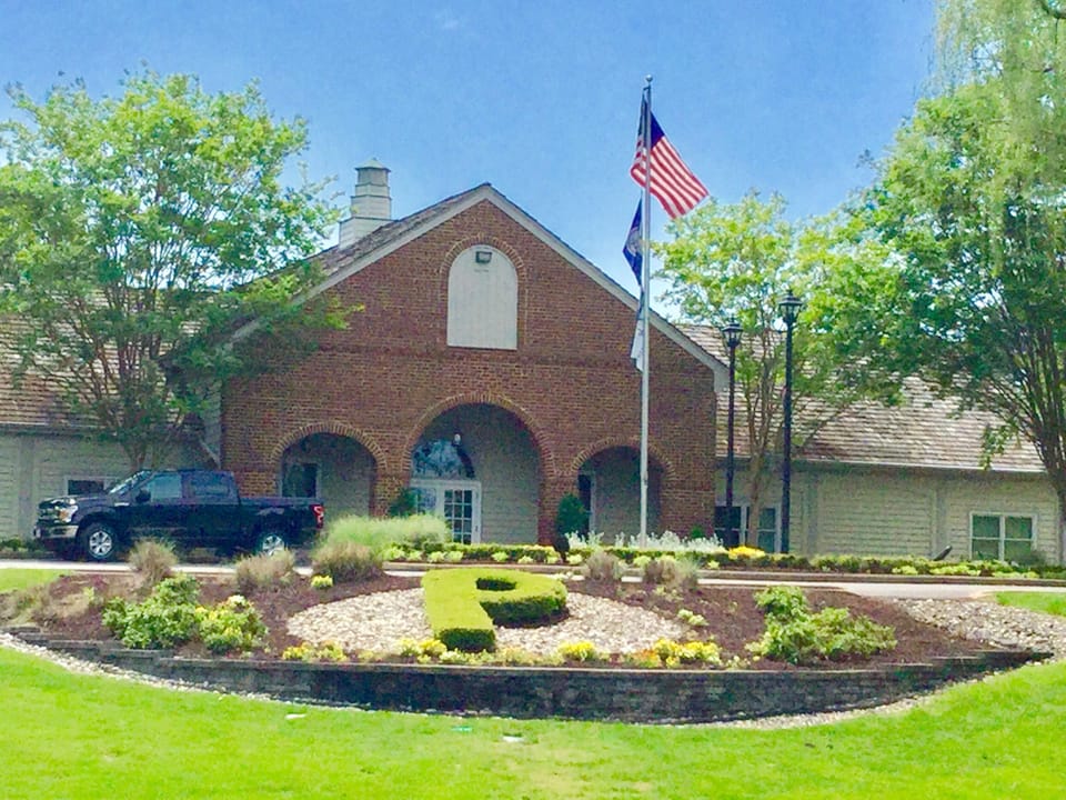 Beautiful lawns and landscaping throughout.