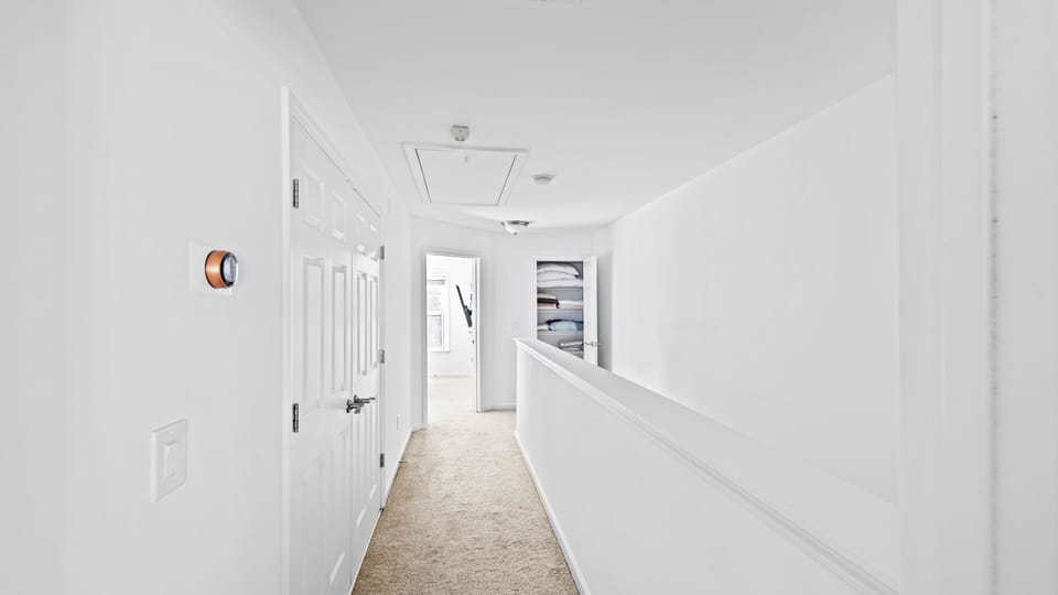 Hallway connecting the bedrooms on the upper floor.
