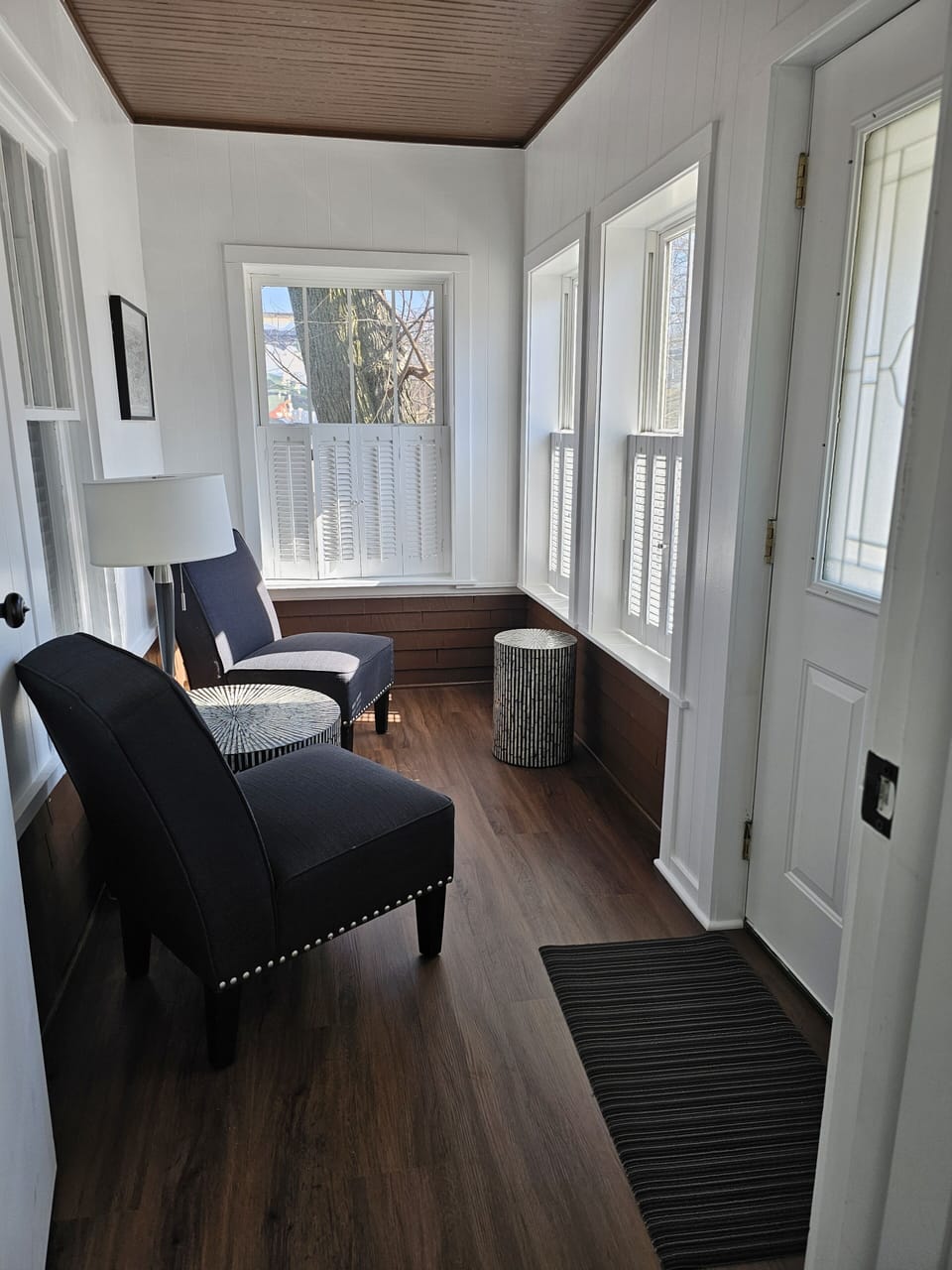 Relax for an early morning coffee in the newly redone sunroom.