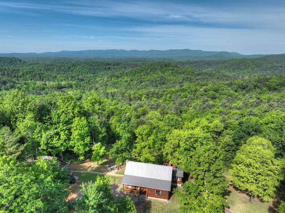 Surrounded by rolling mountain scenery and lush forest views, this dog-friendly luxury cabin rental offers the perfect escape from everyday life