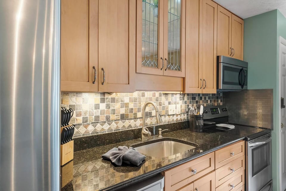 Beautiful Kitchen - With all that you'll need to dine and cook, this condo has granite countertops and stainless steel appliances.  Plenty of space for groceries.