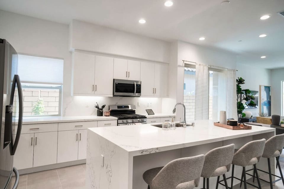 A sleek kitchen with a spacious island
