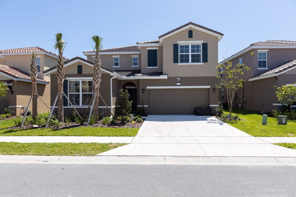 Front of 7 bedroom + 5 bathroom house. Empty garage + 2 parking spaces that can be double stacked for night parking. No overnight street parking allowed in community. 