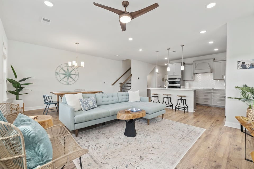 Living room with cozy, modern furnishings and custom wood pieces throughout. 