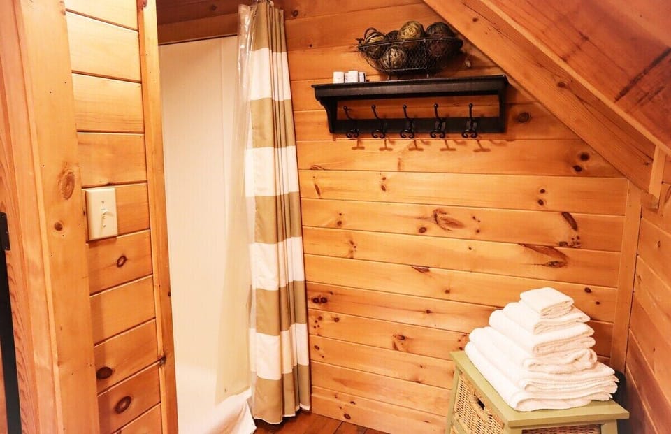Indulge in a revitalizing shower experience in the upstairs bathroom.
