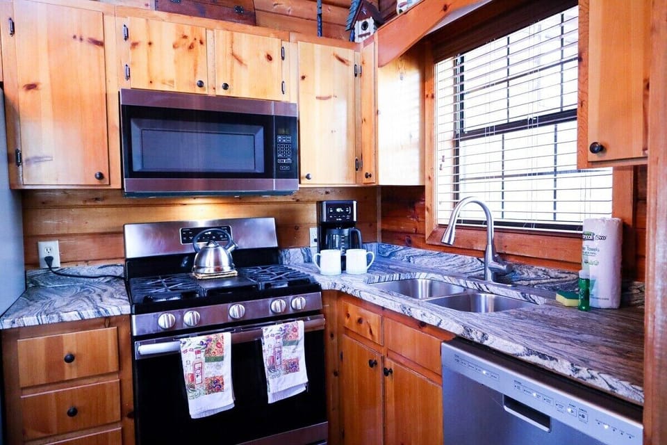 Indulge in a lavish feast prepared in a chic, stainless steel kitchen boasting exquisite marble countertops.