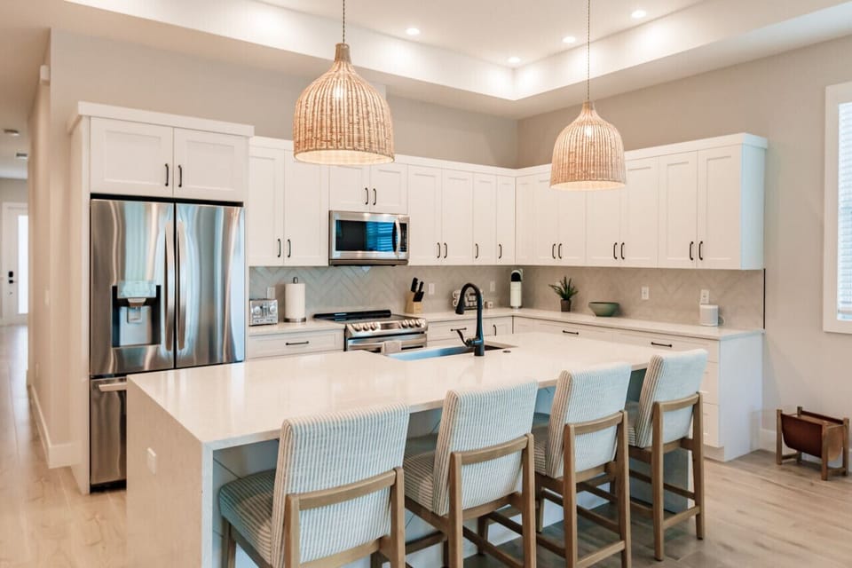 Fully Stocked Kitchen with Bar Stools.