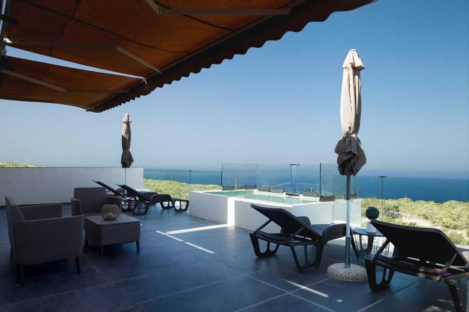 Sunbeds and pool chairs provided.