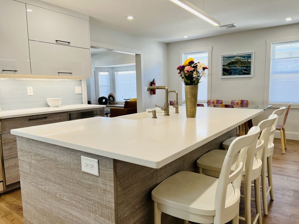 Sunny and bright Chef's kitchen adjoins the two living areas and dining.