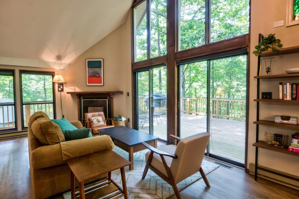 Living room with views of the forest.