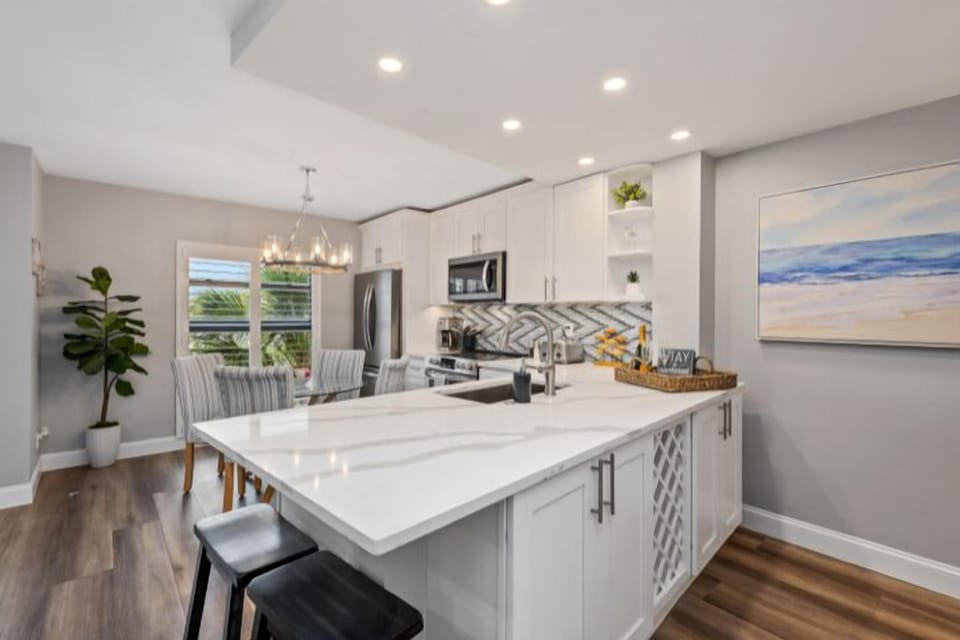 Grab a snack or glass of bubbly while sitting at the countertop bar.