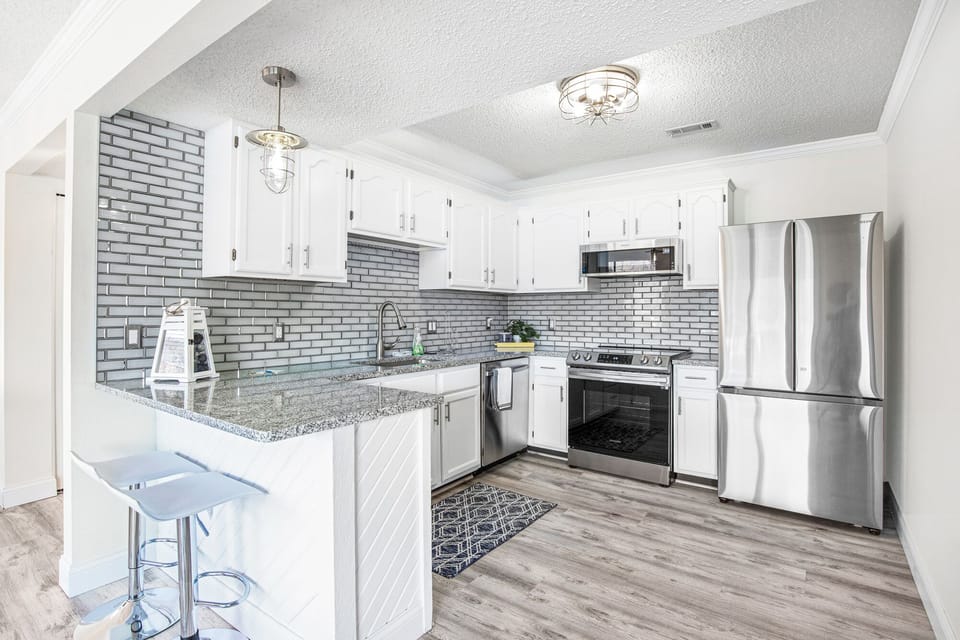 Large kitchen with space for two more at the counter top