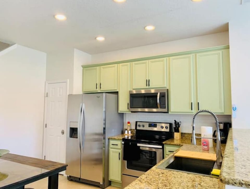 Kitchen farm sink and new stainless steel appliances 