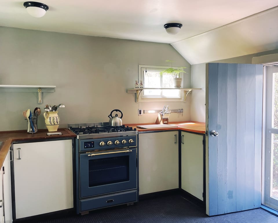 Kitchen with gas range and resin counters